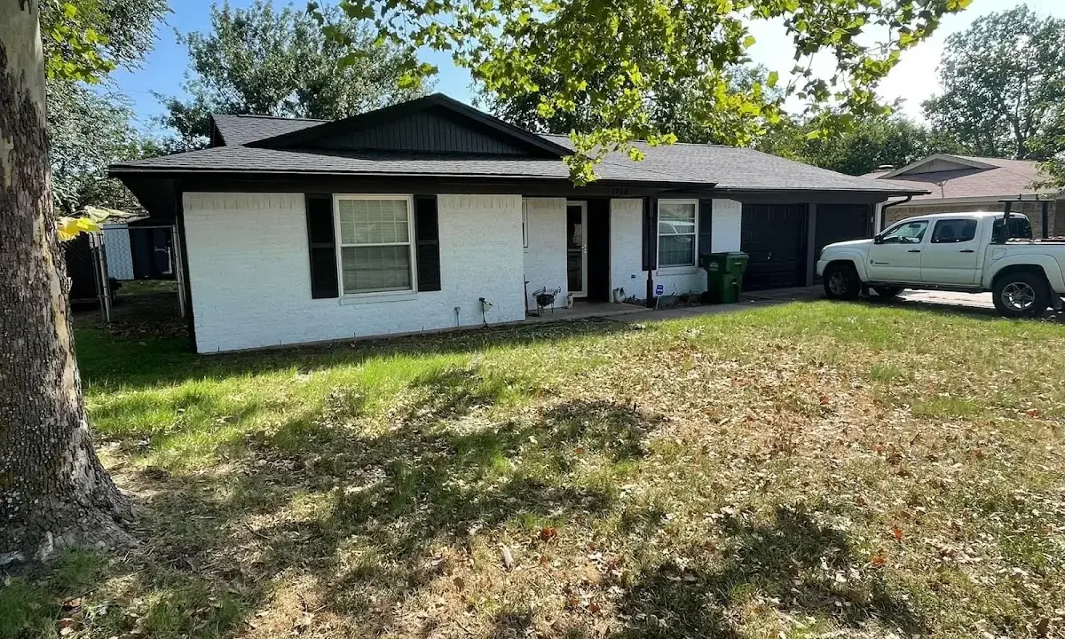 Professional roofing crew working on a residential roof in Hiawatha